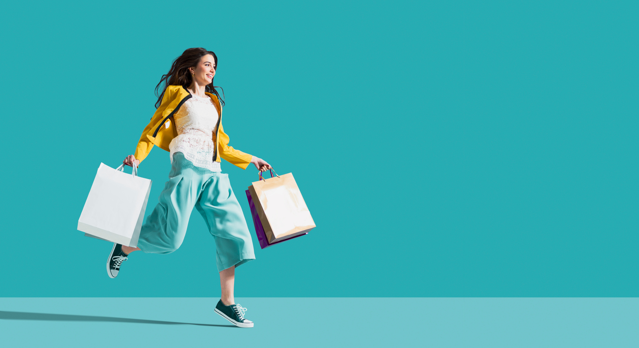 Cheerful happy woman enjoying shopping